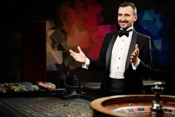 A glowing roulette wheel with cascading chips, symbolizing the engaging live and instant-win games available on BANGBED.