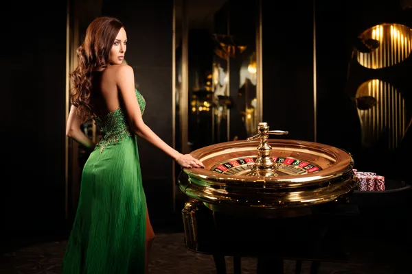 A person using their device against a moody casino-themed background, illustrating the smooth re-entry process at BANGBED.